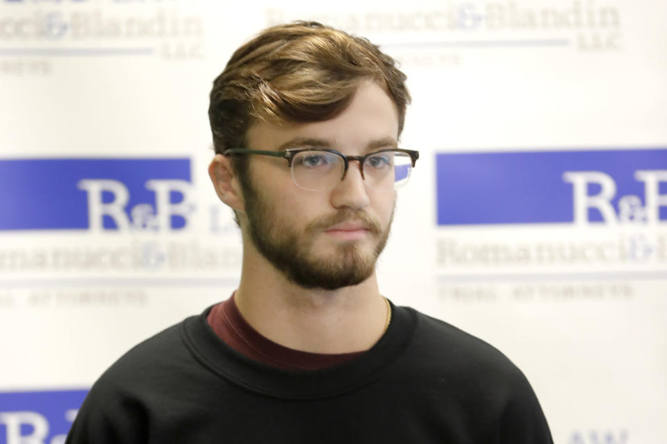 Adam Hergenreder, attends a news conference where his attorney announced the filing of a civil lawsuit against e-cigarette maker Juul on his behalf Friday, Sept. 13, 2019, in Chicago. The lawsuit filed Friday in Lake County, Illinois, Circuit Court alleges Juul Labs, Inc., deliberately targeted young people through Instagram and other sites to suggest vaping can boost their social status. It also says Juul doesn't fully disclose their products contain dangerous chemicals. (AP Photo/Charles Rex Arbogast)