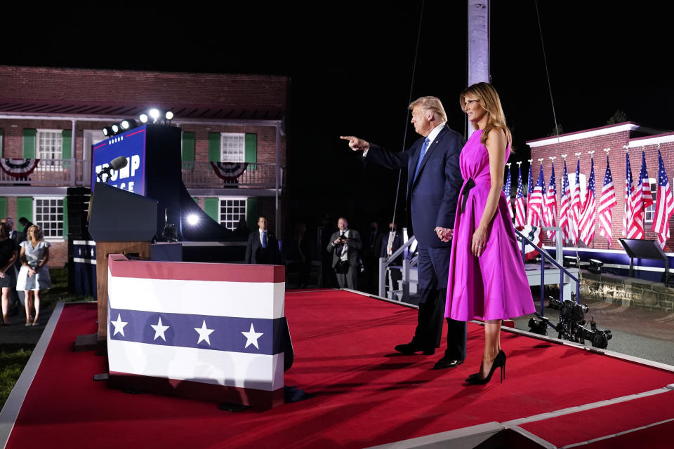 President Donald Trump and first Lady Melania Trump stand on stage on the third day of the Republican National Convention at Fort McHenry National Monument and Historic Shrine in Baltimore, Wednesday, Aug. 26, 2020. (AP Photo/Andrew Harnik)