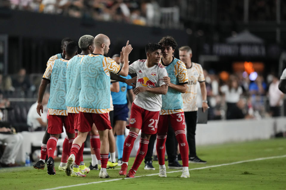 New York Red Bulls midfielder Omir Fernandez, center, is congratulated by teammates after scoring against Inter Miami during the first half of an MLS soccer match Friday, Sept. 17, 2021, in Fort Lauderdale, Fla. (AP Photo/Rebecca Blackwell)