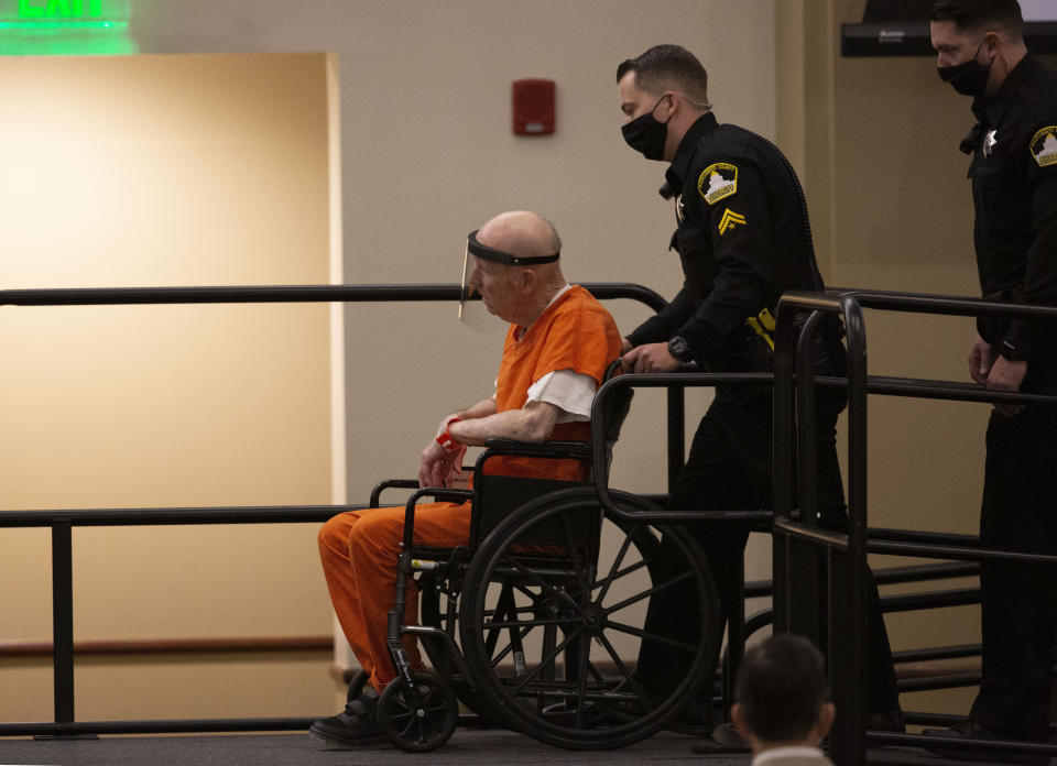 Joseph James DeAngelo, charged with being the Golden State Killer, is wheeled into the courtroom in Sacramento, Calif., Monday, June 29, 2020. DeAngelo, 74, pleaded guilty to multiple counts of murder and other charges 40 years after a sadistic series of assaults and slayings in California. Due to the large numbers of people attending, the hearing was held at a ballroom at California State University, Sacramento to allow for social distancing. (AP Photo/Rich Pedroncelli)