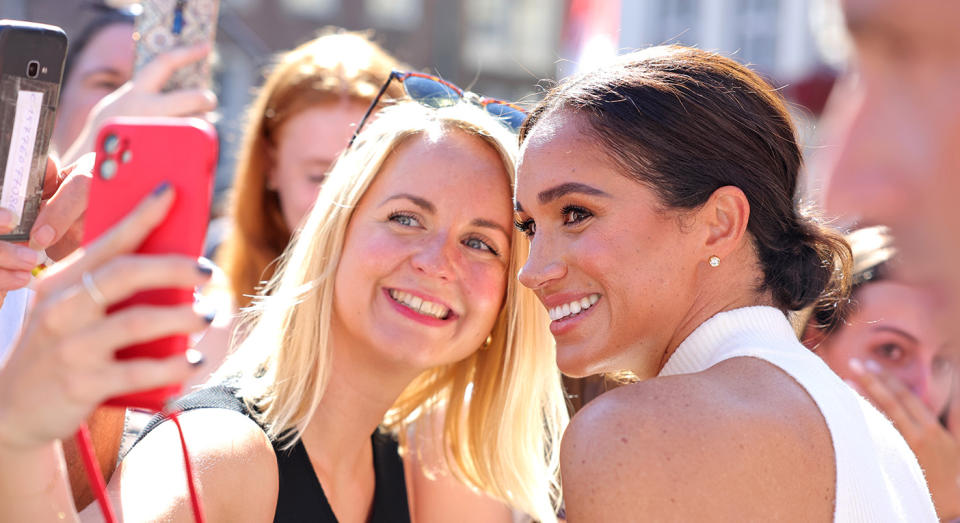 Meghan Markle takes selfie with a fan