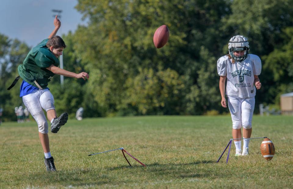 Richwoods kickers Cole Long, left, and Jasmine Bisping take turns kicking field goals during practice Monday, Sept. 18, 2023 at Richwoods High School.
