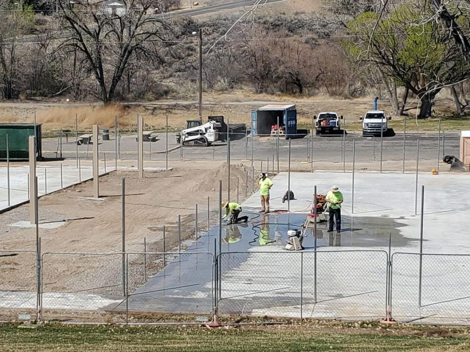 Crews from the City of Farmington laying down courts for what will soon be dedicated Pickleball courts at Brookside Park, scheduled to be completed this summer.