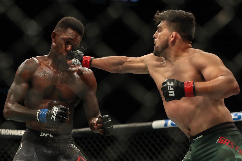 ATLANTA, GA - APRIL 13: Kelvin Gastelum throws a punch at Israel Adesanya of Nigeria in their interim middleweight championship bout during the UFC 236 event at State Farm Arena on April 13, 2019 in Atlanta, Georgia. (Photo by Carmen Mandato/Zuffa LLC via Getty Images)