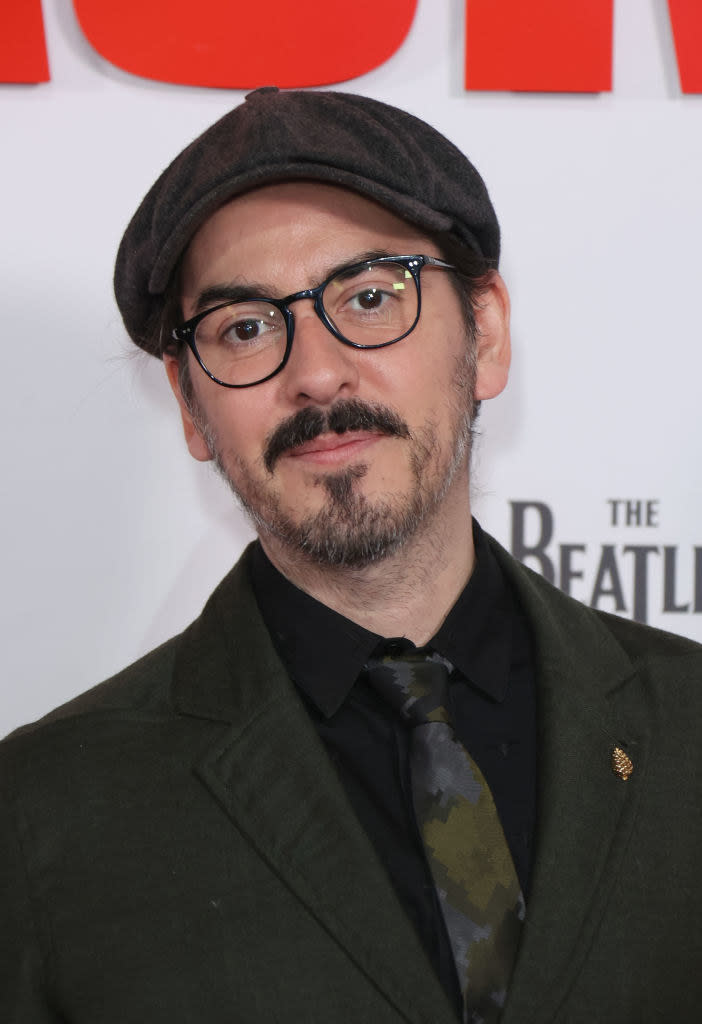Dhani Harrison in glasses and a cap at "The Beatles: Get Back" premiere