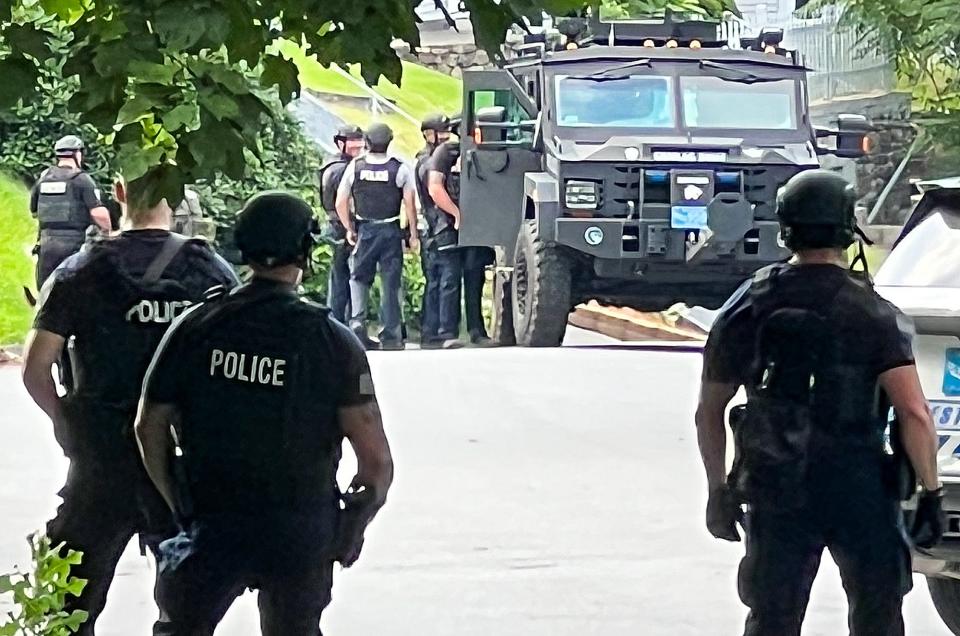 Worcester Police officers, including a tactical unit, during the 13-hour standoff on Colby Avenue Friday.