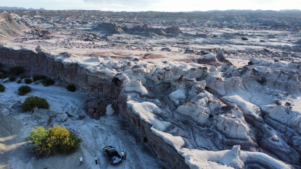 Aerial view of an arid, weathered and rocky landscape.