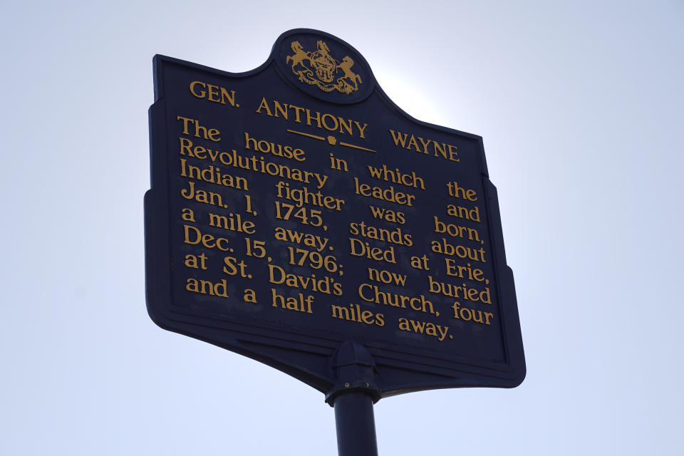 Shown is a Pennsylvania Historical Marker for Revolutionary War Gen. Anthony Wayne in Paoli, Pa., Thursday, Nov. 18, 2021. A recent review of all 2,500 markers the Pennsylvania Historical and Museum Commission had been installing for more than a century, faced a fresh round of questions about just whose stories were being told on the state's roadsides, and the language used to tell them. The increased scrutiny that has focused on factual errors, inadequate historical context and racist or otherwise inappropriate references, prompting the state to remove two markers, revise two and order new text for two others so far. The changes have become grist for the political mill. (AP Photo/Matt Rourke)