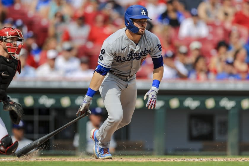 Los Angeles Dodgers' Gavin Lux watches as he hits a two-run triple during the fifth inning of a baseball game against the Cincinnati Reds in Cincinnati, Saturday, Sept. 18, 2021. (AP Photo/Aaron Doster)