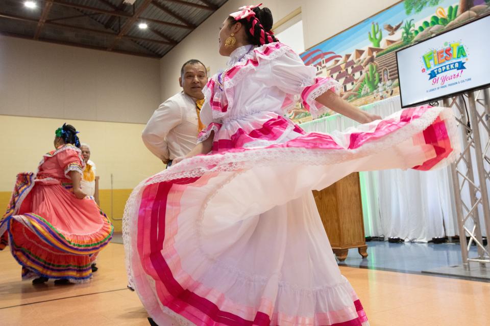 Ballet Folklorico de Topeka dancers, from left, Chris Hernandez, Michelle Meraz, Jose Cerca Jr. and Alisoa Torres, perform at a news conference held Wednesday to spotlight the annual Fiesta Topeka, which will be July 16 to 20.