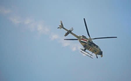 An Iraqi army helicopter fires during a battle with Islamic State's militants south west Mosul, Iraq February 24, 2017. REUTERS/Zohra Bensemra