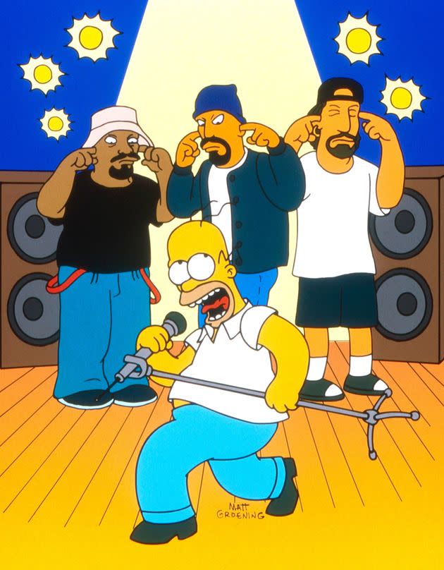 TSDSIMP FE156 THE SIMPSONS, Cypress Hill (back from left): Sen-Dog (aka Sen D.O.G. - voice: Sen D.O.G.), B-Real (voice: B-Real), Deejay Muggs (aka DJ Muggs - voice: Deejay Muggs) front: Homer Simpson, 'Homerpalooza', (Season 7, ep. 724, aired May 19, 1996). TM and Copyright © 20th Century Fox Film Corp. All rights reserved. /Courtesy Everett Collection