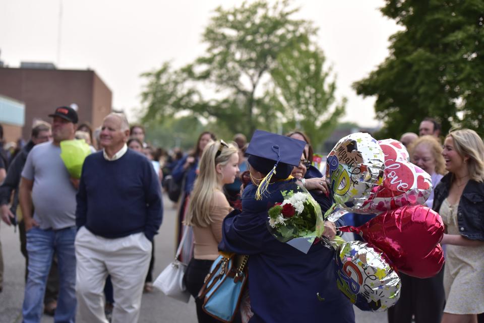 Port Huron Northern graduate embracing a loved one after the commencement ceremony on June 6, 2023.