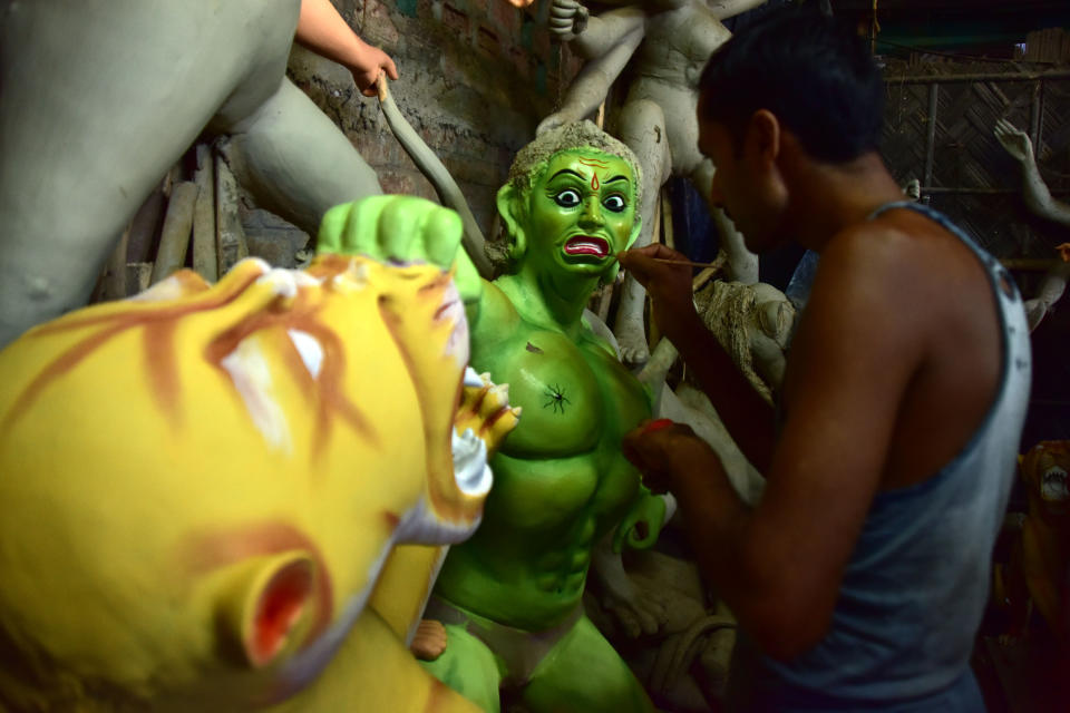 ASSAM,INDIA-OCTOBER 9,2020:An artist finishing Asura where Durga idols are being prepared ahead of the biggest Hindu festival Durga puja in Nagaon District of Assam ,india - PHOTOGRAPH BY Anuwar Ali Hazarika / Barcroft Studios / Future Publishing (Photo credit should read Anuwar Ali Hazarika/Barcroft Media via Getty Images)