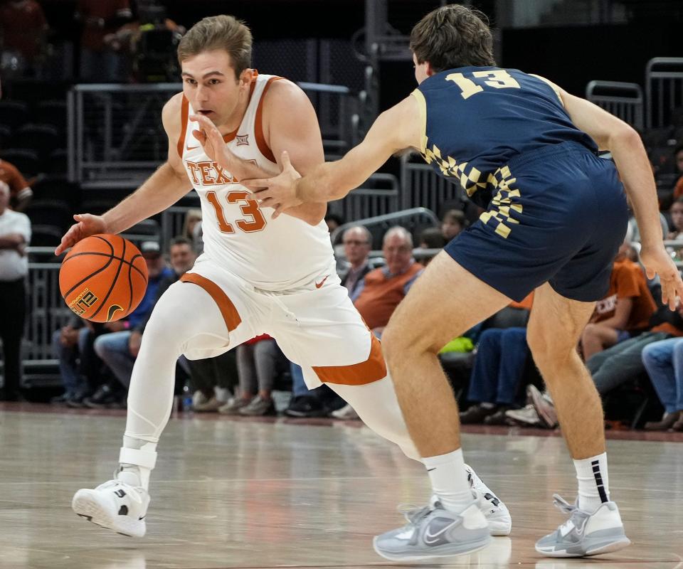 Texas guard Gavin Perryman, left, will enter the transfer portal, a Texas official confirmed Monday. Perryman is the second reserve player to enter the portal this offseason.