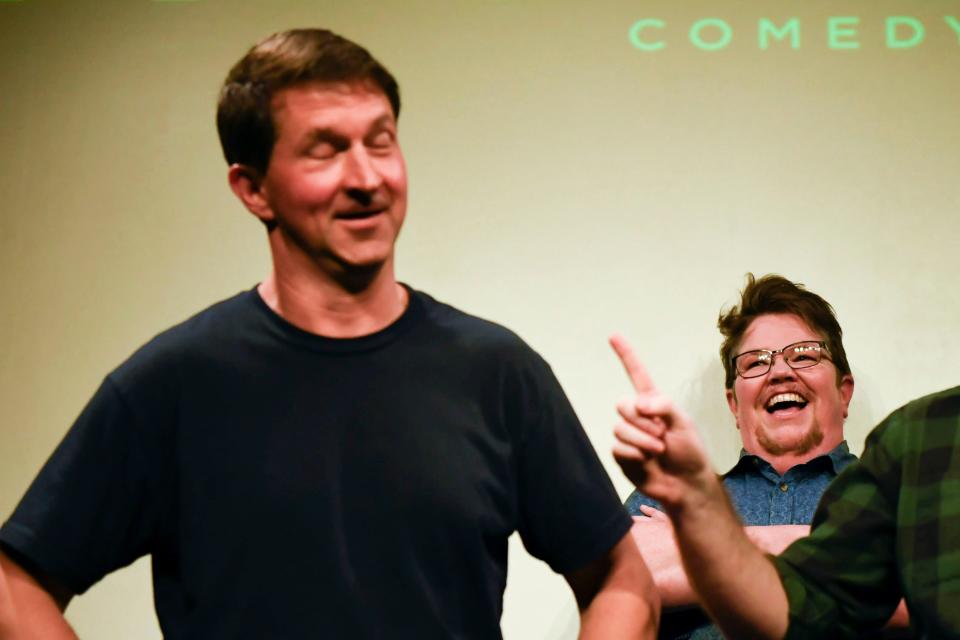 Bex Miller laughs at Andy Roark while performing an improv show called Local Legends at Alchemy Comedy in downtown Greenville, S.C., on Friday, June 30 , 2023.