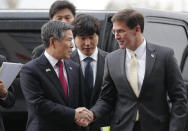 U.S. Defense Secretary Mark Esper, right, talks with South Korean Defense Minister Jeong Kyeong-doo upon his arrival for the 51st Security Consultative Meeting (SCM) at Defense Ministry in Seoul, South Korea, Friday, Nov. 15, 2019. (AP Photo/Lee Jin-man)