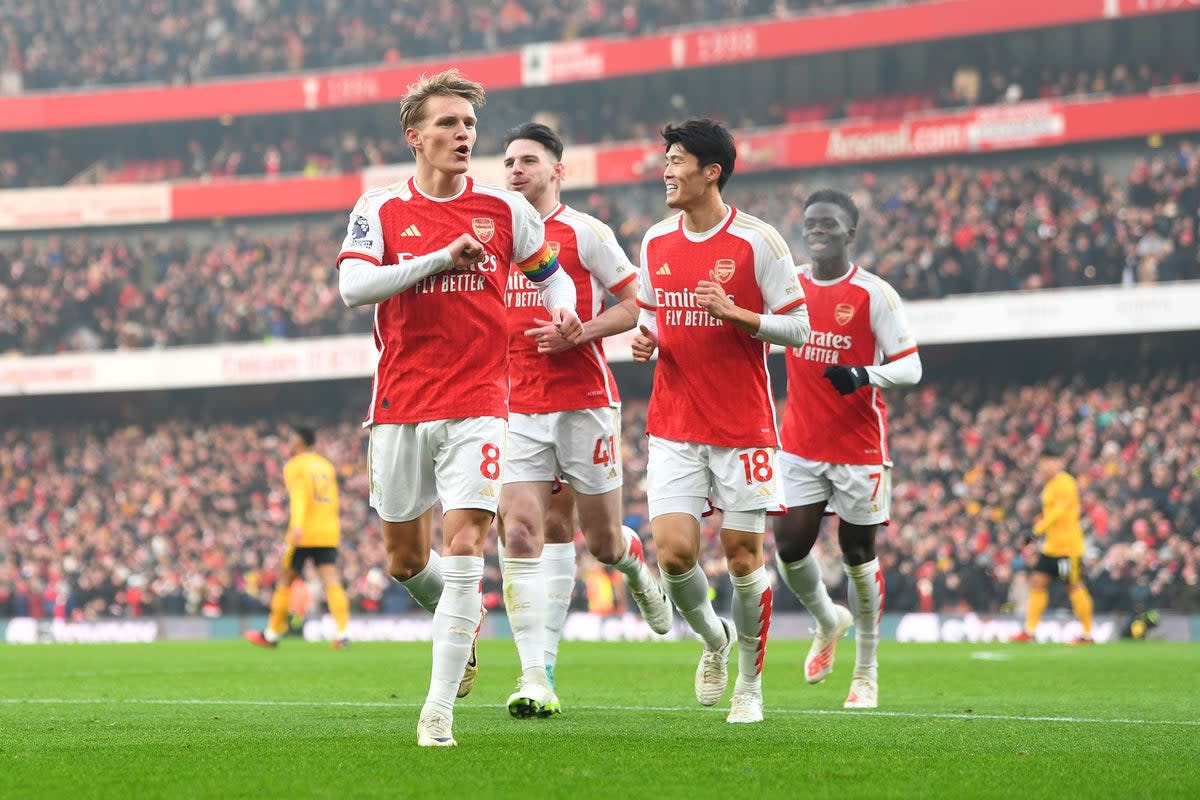 On target: Martin Odegaard celebrates putting Arsenal 2-0 up early against Wolves (Arsenal FC via Getty Images)