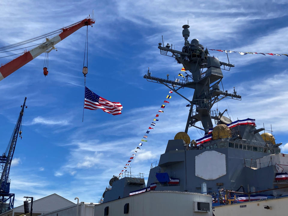 The superstructure of the future USS Basilone and a crane are seen on Saturday, June 18, at Bath Iron Works in Bath, Maine. The christening of a Navy destroyer on Saturday highlighted the sacrifices of two generations — the ship’s namesake killed in World War II and another Marine who died more than 60 years later. The future USS Basilone bears the name of a Marine who was awarded the Medal of Honor before his death on Iwo Jima. (AP Photo/David Sharp)