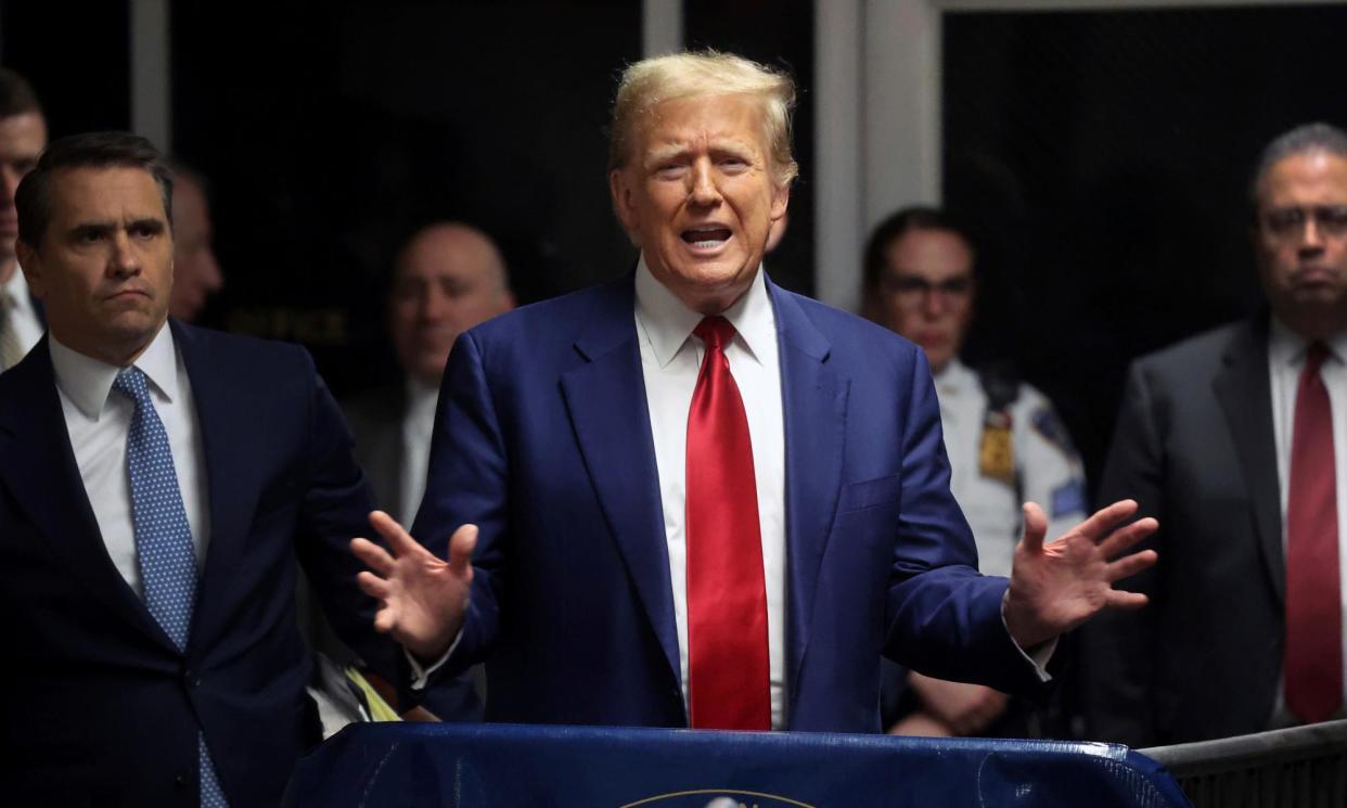 <span>Donald Trump speaks after hearing at New York criminal court on 25 March 2024.</span><span>Photograph: Spencer Platt/AP</span>