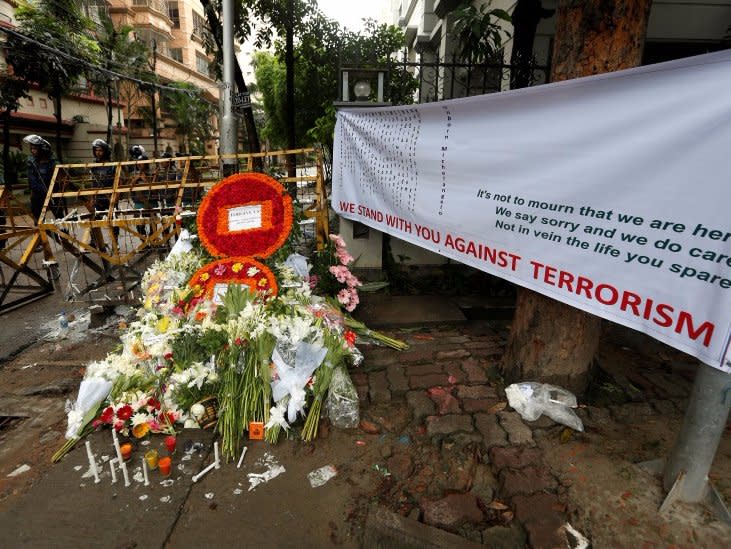 Wreaths and flowers, offered by people to pay tribute to the victims of the attack on the Holey Artisan Bakery and the O'Kitchen Restaurant, are pictured at a makeshift memorial near the attack site, in Dhaka, Bangladesh, July 5, 2016. REUTERS/Adnan Abidi