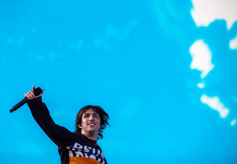 Porter Robinson smiles to fans while performing on the Coachella stage during the Coachella Valley Music and Arts Festival at the Empire Polo Club in Indio, Calif., Saturday, April 22, 2023. 