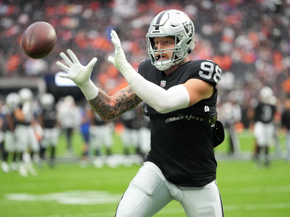 Oct 2, 2022; Paradise, Nevada, USA; Las Vegas Raiders defensive end <a class="link " href="https://sports.yahoo.com/nfl/players/31938" data-i13n="sec:content-canvas;subsec:anchor_text;elm:context_link" data-ylk="slk:Maxx Crosby;sec:content-canvas;subsec:anchor_text;elm:context_link;itc:0">Maxx Crosby</a> (98) warms up before a game against the Denver Broncos at Allegiant Stadium. Mandatory Credit: Stephen R. Sylvanie-USA TODAY Sports