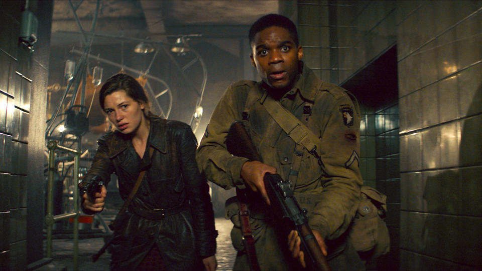 Mathilde Ollivier & Jovan Adepo in <em>Overlord</em> 