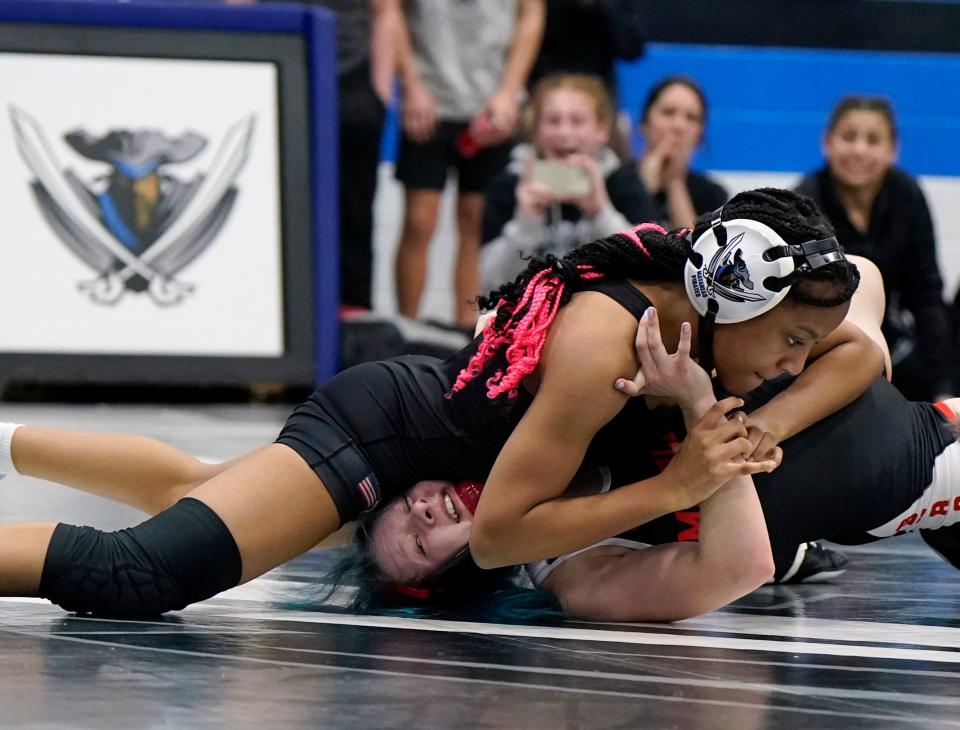 Matanzas' R'Cardenay Michel attempts to pin Middleburg's Memphis Moses during the District 3-1A Tournament at Matanzas High School, Wednesday, Feb. 7, 2024.