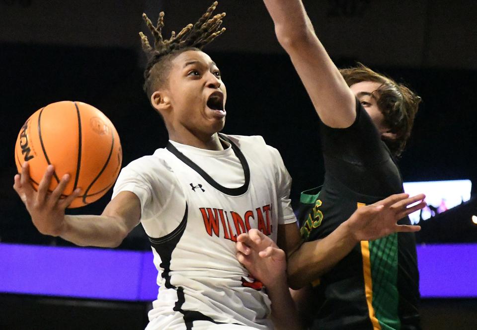 New Hanover's #3 Rodmik Allen drives to the basket for a shot as New Hanover took on Richmond in the 2024 NCHSSAA Men’s Basketball Championship playoff game Thursday March 14, 2024 at the LJVM Coliseum in Winston-Salem, N.C. New Hanover won 55-53 and will move on to the State Championship game Saturday. KEN BLEVINS/STARNEWS