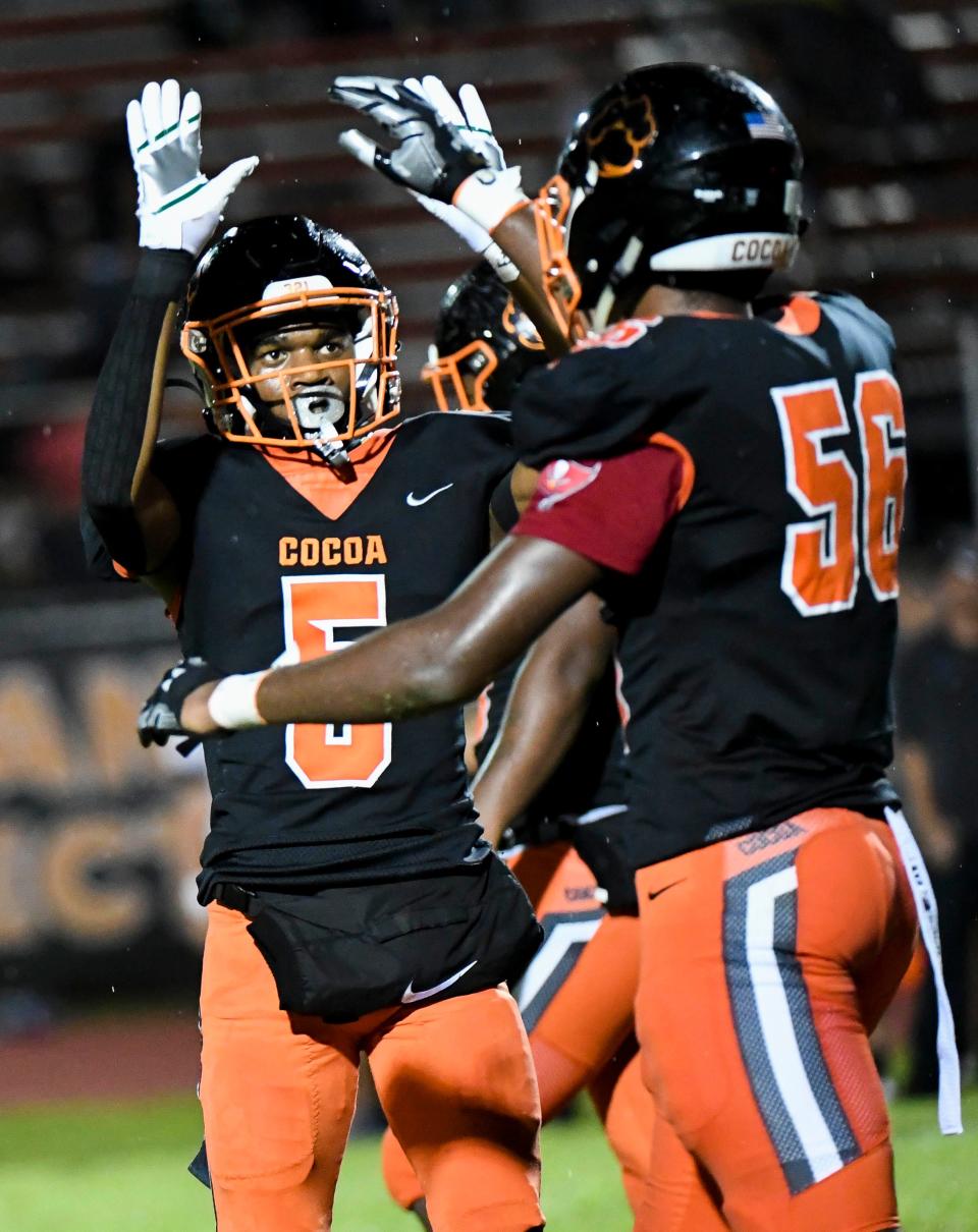 Caleb Dobbs congratulates teammate Javion Hilson after his sack of Space Coast QB Friday September 16, 2022. Craig Bailey/FLORIDA TODAY via USA TODAY NETWORK