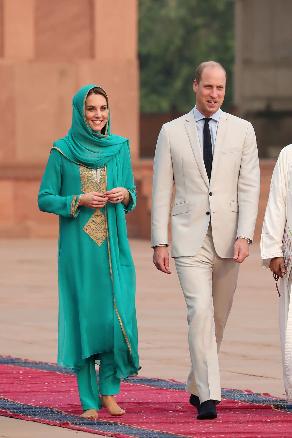 <p>The Duchess of Cambridge visits the Badshahi Mosque within the Walled City during day four of their royal tour of Pakistan. She wore a green and gold shalwar kameez. </p>