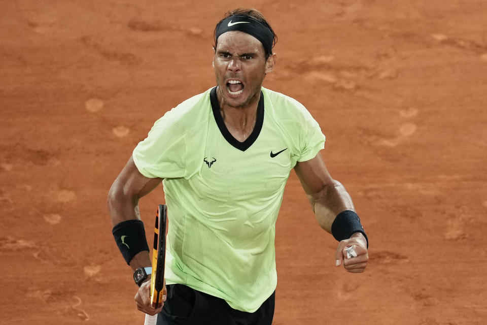 Spain's Rafael Nadal celebrates winning a point as he plays Serbia's Novak Djokovic during their semifinal match of the French Open tennis tournament at the Roland Garros stadium Friday, June 11, 2021 in Paris. (AP Photo/Thibault Camus)