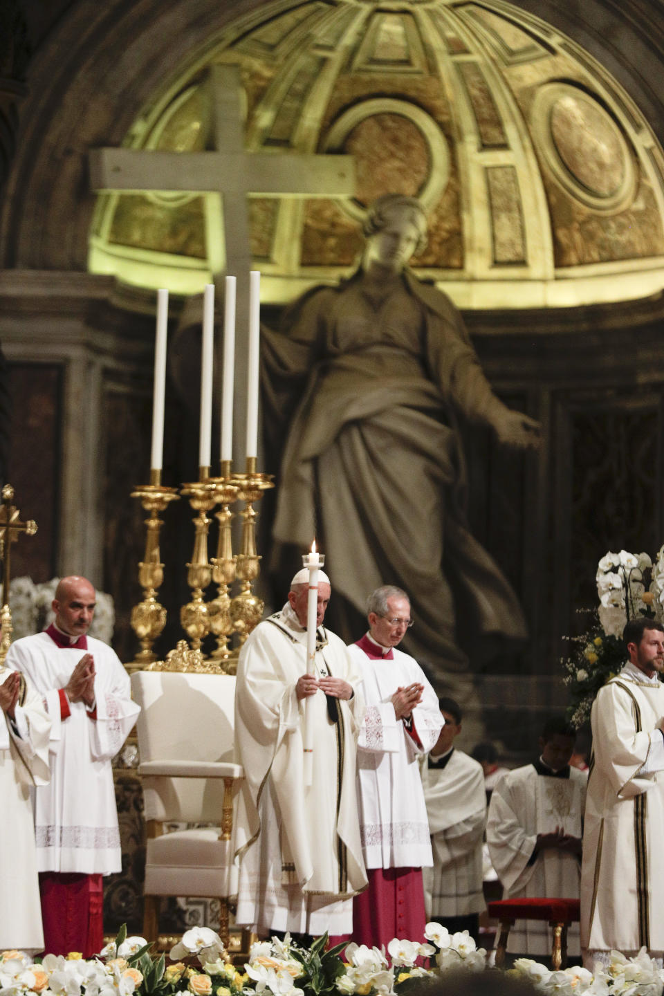 Pope Francis presides over a solemn Easter vigil ceremony in St. Peter's Basilica at the Vatican, Saturday, April 21, 2019. (AP Photo/Gregorio Borgia)