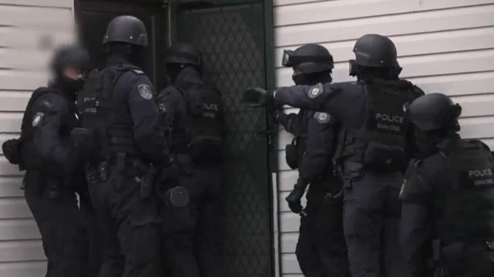 Tactical police storm the Doonside home on Wednesday afternoon. Picture: Supplied