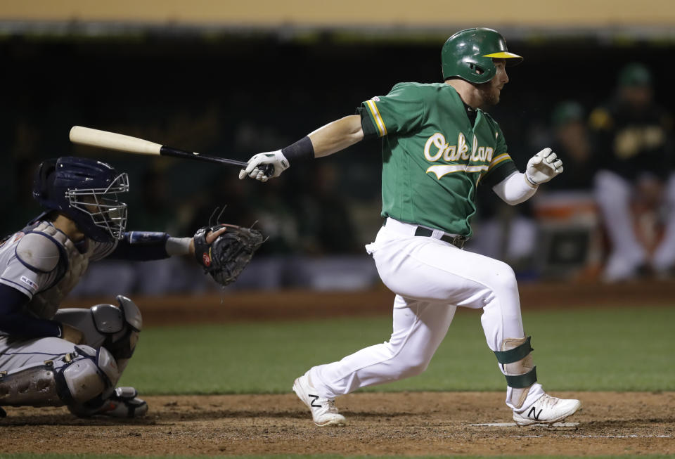 Oakland Athletics' Robbie Grossman swings for the game-winning hit in the 13th inning of a baseball game against the Houston Astros Friday, Aug. 16, 2019, in Oakland, Calif. (AP Photo/Ben Margot)