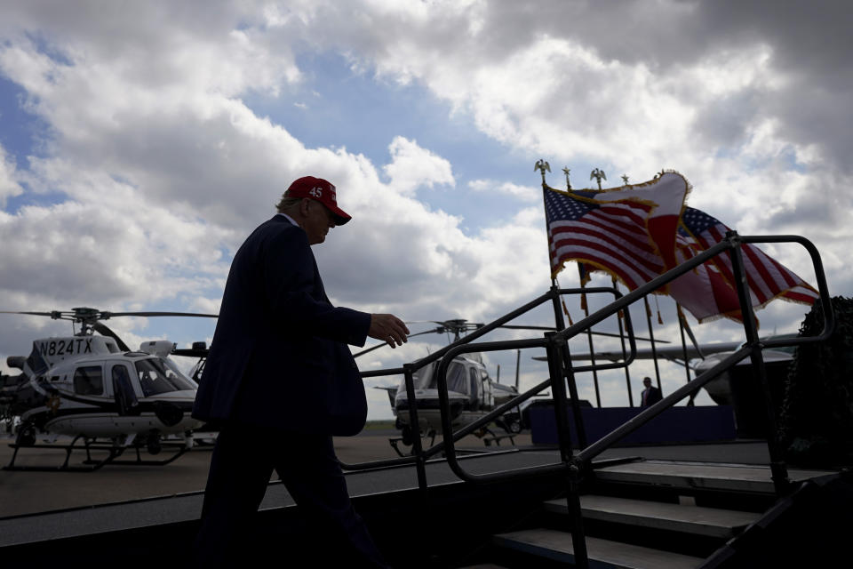 Republican presidential candidate and former President Donald Trump walks on stage as he prepares to speak to supporters at the South Texas International Airport Sunday, Nov. 19, 2023, in Edinburg, Texas. (AP Photo/Eric Gay)