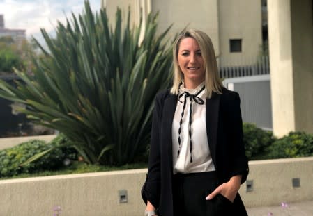 Bertuzzi, sales and marketing consultant for Robert Walters, poses for a picture during an interview with Reuters in Santiago