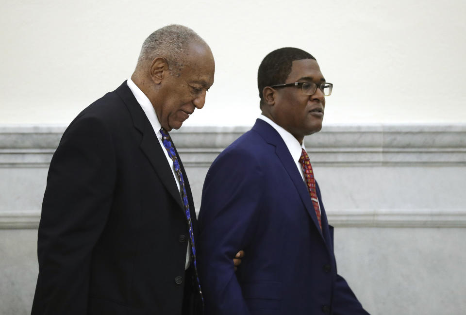 Bill Cosby is led from the courtroom during a break by his spokesman Andrew Wyatt at the Montgomery County Courthouse, during his sentencing hearing in Norristown, Pa., Monday, Sept. 24, 2018. (David Maialetti/The Philadelphia Inquirer via AP, Pool)