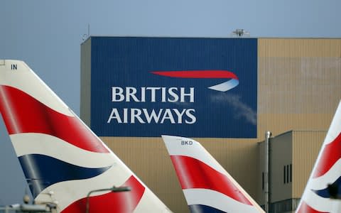 British Airways logos are seen on tail fins at Heathrow Airport - Credit: REUTERS/Hannah McKay