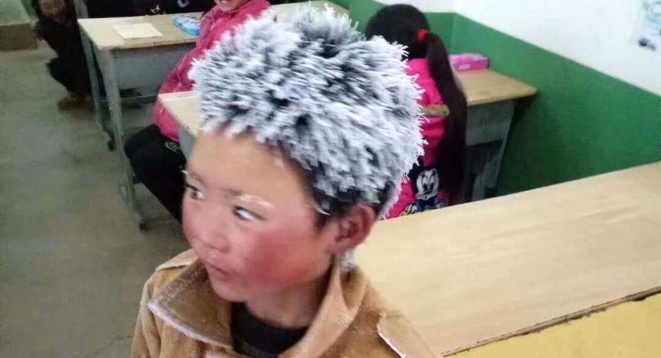 Wang Fuman had icicles in his hair and eyelashes after his long walk to school