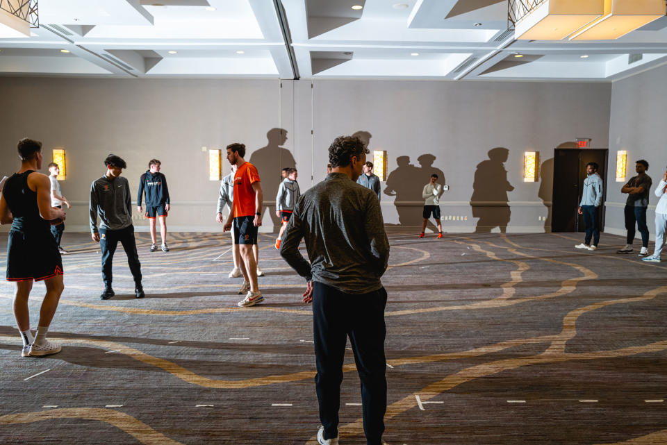 Mitch Henderson watches as the team practices a play in the hotel ballroom on March 23, 2023.<span class="copyright">Jon Cherry for TIME</span>