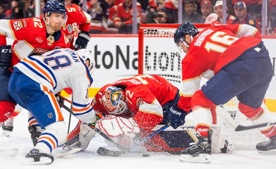 Florida Panthers goaltender Sergei Bobrovsky (72) and center Aleksander Barkov (16) work to stop Edmonton Oilers left wing Zach Hyman (18) from scoring in the second period of Game 1 of the NHL Stanley Cup Finals at the Amerant Bank Arena on Saturday, June 8, 2024, in Sunrise, Fla.