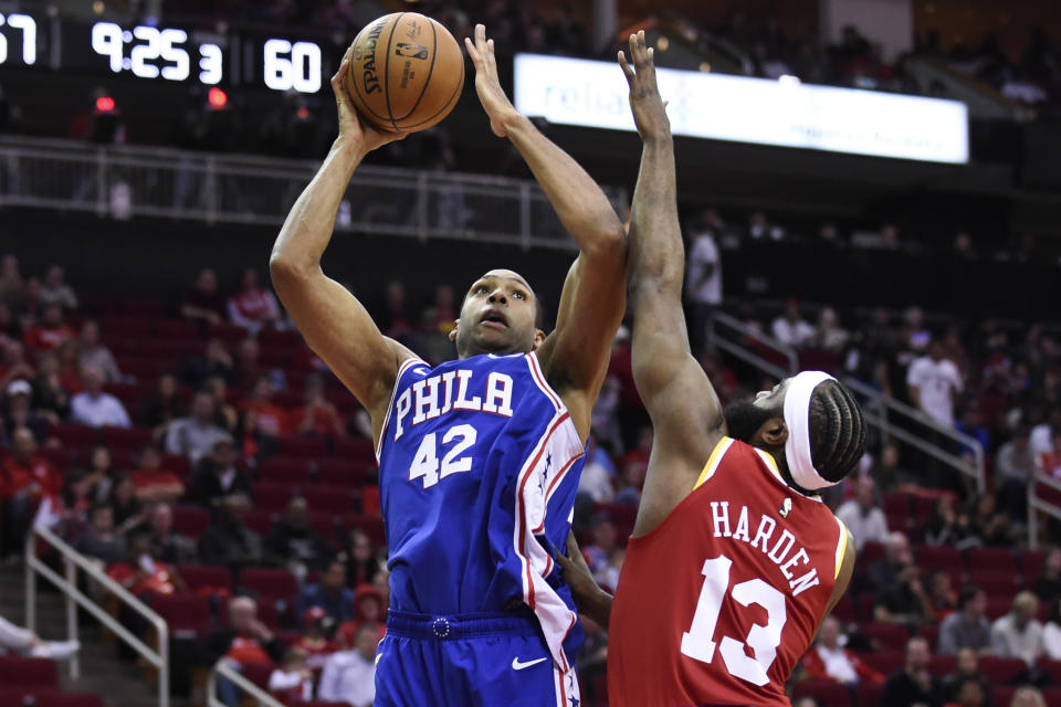 Philadelphia 76ers center Al Horford (42) shoots as Houston Rockets guard James Harden defends during the second half of an NBA basketball game, Friday, Jan. 3, 2020, in Houston. (AP Photo/Eric Christian Smith)