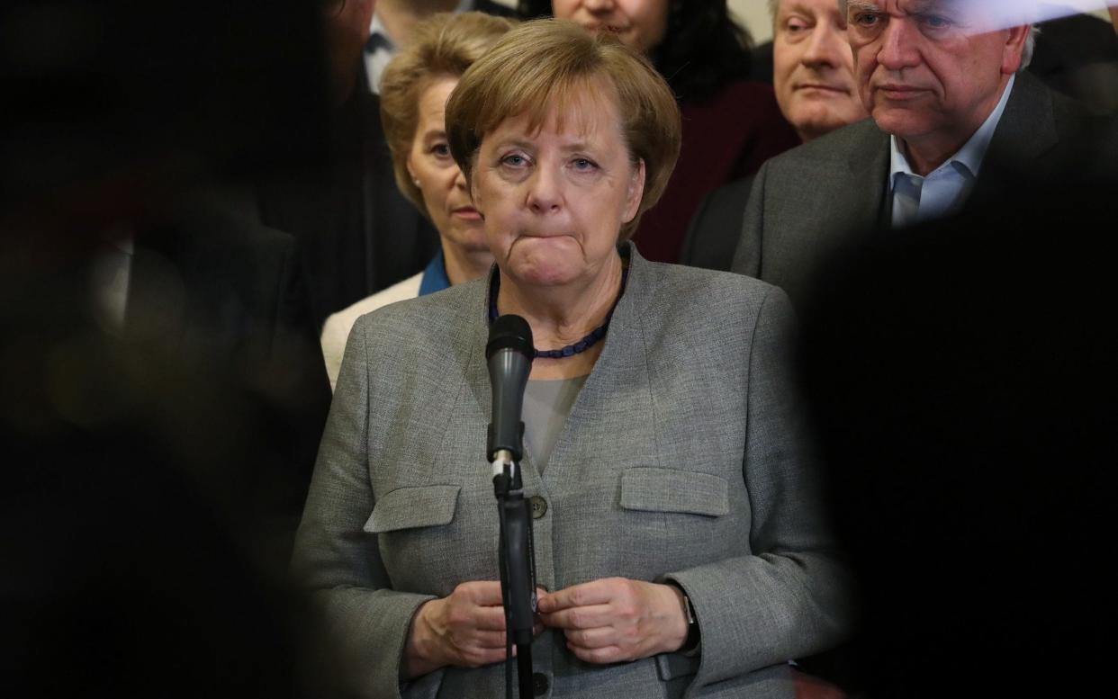 A downcast Angela Merkel addresses media after the collapse of coalition talks - Getty Images Europe