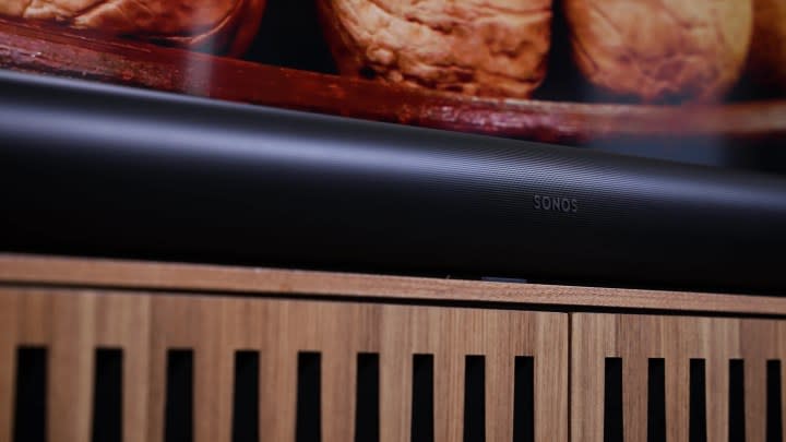 A closeup on a Sonos Src Soundbar on a media stand. 