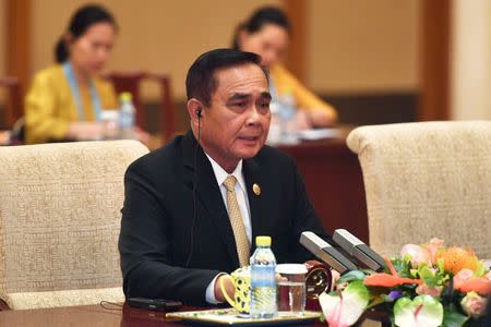 FILE PHOTO: Thailand's Prime Minister Prayuth Chan-ocha speaks to Chinese Premier Li Keqiang (not pictured) during their meeting at the Diaoyutai State Guesthouse in Beijing, China, April 26, 2019. Parker Song/Pool via REUTERS/File Photo