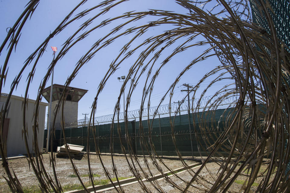 The control tower is seen through the razor wire inside the Camp VI detention facility in Guantanamo Bay Naval Base, Cuba, in 2019.  (Alex Brandon / AP)