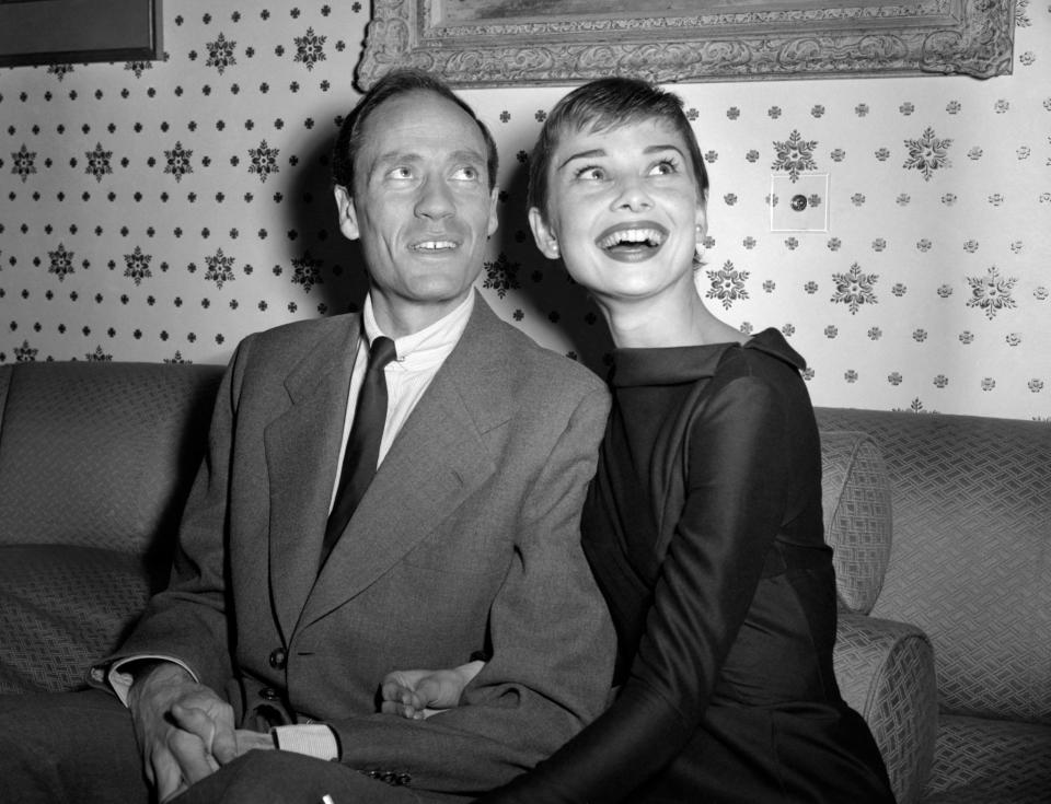 With her husband Mel Ferrer at party in 1954