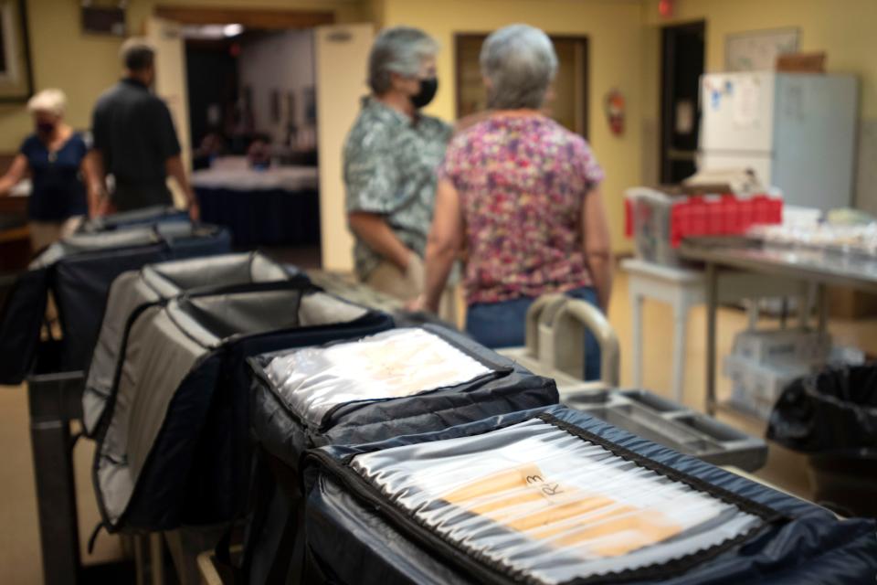 Volunteer drivers trickle in to wait for hot meals to arrive before they go out for delivery for Meals on Wheels at Central Bucks Senior Center in Doylestown on Tuesday, July 5, 2022. 